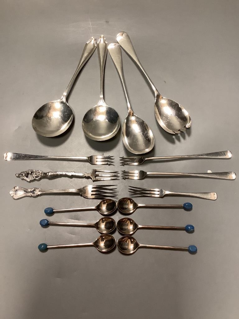 A pair of George V silver serving spoons, Sheffield, 1916, a pair of similar salad servers, a 800 fork, five other silver pieces of cutlery and seven plated items